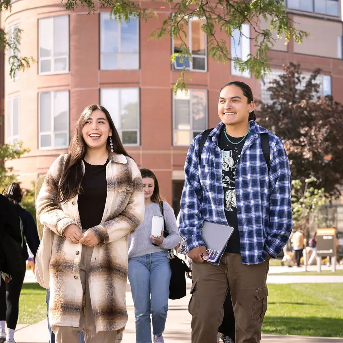 Two students walking on campus.